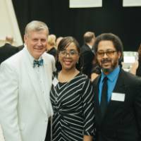 President Tom Haas posing with guests.